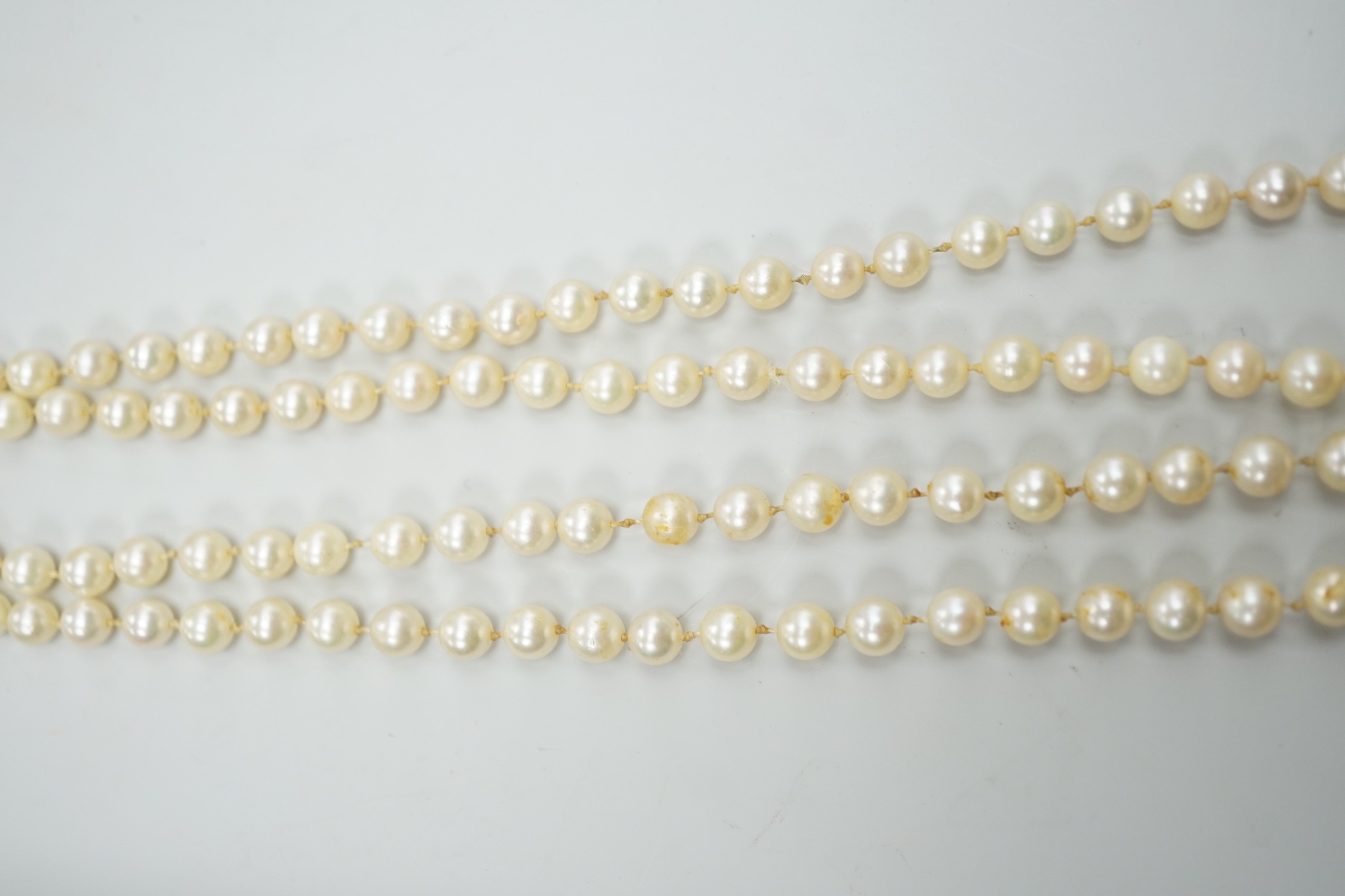 A single strand cultured pearl necklace, with 9ct white gold and diamond chip set clasp, 80cm.